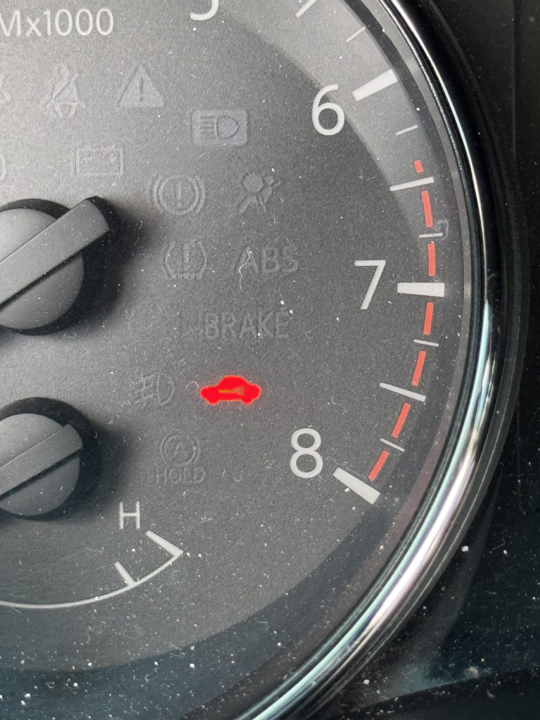 What Is The Red Car Symbol On Dashboard Nissan